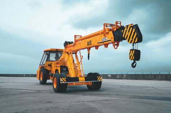 ACE crane on site with boom extended and hook lowered